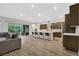 Modern kitchen with island seating and sliding door access to backyard at 349 Agnew St, Las Vegas, NV 89138