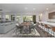 Open concept kitchen with island, stainless steel appliances, and dark brown cabinetry at 349 Agnew St, Las Vegas, NV 89138