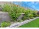 Landscaped retaining wall with various plants at 349 Agnew St, Las Vegas, NV 89138