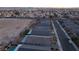 An aerial view showcasing homes with green spaces, and swimming pools at 3540 Valley Lily St, North Las Vegas, NV 89032