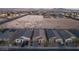 An aerial view showcases homes adjacent to a desert landscape in a new construction neighborhood at 3540 Valley Lily St, North Las Vegas, NV 89032