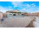 Covered patio and spacious backyard with desert landscaping at 3540 Valley Lily St, North Las Vegas, NV 89032