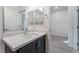 Bathroom featuring a modern vanity with sleek black cabinets and light countertop at 3540 Valley Lily St, North Las Vegas, NV 89032