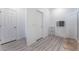 Bathroom area with walk-in shower, linen storage, and tile flooring at 3540 Valley Lily St, North Las Vegas, NV 89032