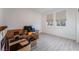 This bedroom features gray wood floors, white walls, and natural light at 3540 Valley Lily St, North Las Vegas, NV 89032