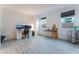 This bedroom showcases wood-look floors, three windows, and ample space for a home office at 3540 Valley Lily St, North Las Vegas, NV 89032