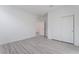 Bedroom with wood-look floors, closet, and fresh white paint at 3540 Valley Lily St, North Las Vegas, NV 89032