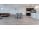 Open concept dining area with seating for four and modern kitchen access at 3540 Valley Lily St, North Las Vegas, NV 89032