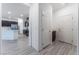 Hallway with an open floor plan that leads to a modern kitchen and dining area at 3540 Valley Lily St, North Las Vegas, NV 89032
