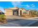 Charming single-story home with a desert landscape, stone accents, and a two car garage at 3540 Valley Lily St, North Las Vegas, NV 89032