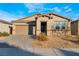 One-story home with a two-car garage and landscaped front yard at 3540 Valley Lily St, North Las Vegas, NV 89032