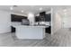 Modern kitchen featuring island, stainless steel appliances, and white shaker cabinets at 3540 Valley Lily St, North Las Vegas, NV 89032