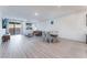 Bright living room with sleek flooring, modern furniture and a sliding glass door at 3540 Valley Lily St, North Las Vegas, NV 89032