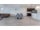Open layout with dining and living space, featuring modern decor and lots of light at 3540 Valley Lily St, North Las Vegas, NV 89032