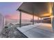 Covered patio area with concrete flooring and brick wall, perfect for outdoor living at 3540 Valley Lily St, North Las Vegas, NV 89032