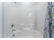 Bright tiled shower with a shower-tub combination at 3540 Valley Lily St, North Las Vegas, NV 89032