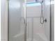 Close-up of a tiled shower featuring a built-in seat and glass door at 3540 Valley Lily St, North Las Vegas, NV 89032