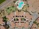 Stunning aerial view of condos, pool, putting green, and tropical landscaping at 4 Via Centrale # 1, Henderson, NV 89011