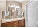 Bathroom boasts dual sinks, granite counters, and updated fixtures at 4 Via Centrale # 1, Henderson, NV 89011