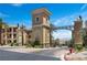 Gated community entrance with grand architecture and landscaping at 4 Via Centrale # 1, Henderson, NV 89011