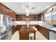 Beautiful kitchen featuring stainless appliances, island, and a bright window with a view at 4 Via Centrale # 1, Henderson, NV 89011