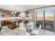 Modern kitchen with island, stainless steel appliances & access to patio at 4 Via Centrale # 1, Henderson, NV 89011