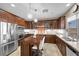 Modern kitchen featuring wood cabinets, stainless steel appliances, and a center island at 4 Via Centrale # 1, Henderson, NV 89011