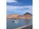 Scenic view of a boat on the lake with mountains in the background at 4 Via Centrale # 1, Henderson, NV 89011