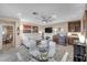 Living area features white sofas, a fireplace, and ceiling fan at 4 Via Centrale # 1, Henderson, NV 89011