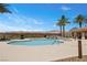 Community pool with lounge chairs and palm trees at 4 Via Centrale # 1, Henderson, NV 89011