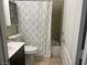 Clean bathroom with a white toilet, tub, and shower at 4029 Grant Hill Ave, North Las Vegas, NV 89081