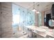 Spa-like bathroom with marble finishes, double vanity, and large shower at 4381 W Flamingo Rd # 1904, Las Vegas, NV 89103