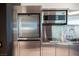 Stainless steel kitchen with microwave and cooktop at 4381 W Flamingo Rd # 1904, Las Vegas, NV 89103