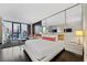 Modern bedroom with a comfortable bed and city views at 4381 W Flamingo Rd # 2310, Las Vegas, NV 89103