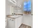 Bright bathroom with double sinks, white cabinets, and a large window at 4439 Yellow Harbor St, Las Vegas, NV 89129