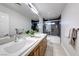 Modern bathroom with double vanity and a walk-in shower at 4620 Clay Peak Dr, Las Vegas, NV 89129