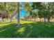 Community common area showcasing lush green grass, trees, and a picnic shelter at 4620 Clay Peak Dr, Las Vegas, NV 89129