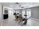 Dining room with dark wood table and white plantation shutters at 4620 Clay Peak Dr, Las Vegas, NV 89129