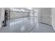 Spacious three-car garage with epoxy flooring and ample storage at 4620 Clay Peak Dr, Las Vegas, NV 89129