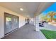 Covered patio with stamped concrete, outdoor kitchen, and access to backyard at 4620 Clay Peak Dr, Las Vegas, NV 89129