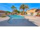 Inviting pool and spa with waterfall feature and ample patio space at 4620 Clay Peak Dr, Las Vegas, NV 89129