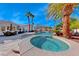 Relaxing pool and spa with surrounding patio and seating area at 4620 Clay Peak Dr, Las Vegas, NV 89129