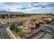 Two-story house with pool and putting green, next to other homes at 4807 Enchanted View St, Las Vegas, NV 89149