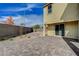 Landscaped backyard with patio and partial view of house at 4807 Enchanted View St, Las Vegas, NV 89149