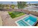 Aerial view of backyard oasis with pool, spa, and putting green at 4807 Enchanted View St, Las Vegas, NV 89149