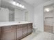 Modern bathroom with dark brown vanity and a walk-in shower at 4807 Enchanted View St, Las Vegas, NV 89149