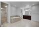 Spa-like bathroom with soaking tub and double vanity at 4807 Enchanted View St, Las Vegas, NV 89149