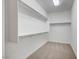 Walk-in closet with carpet flooring and ample shelving and hanging space at 4807 Enchanted View St, Las Vegas, NV 89149