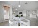 Small dining area with marble table and view into living room at 4807 Enchanted View St, Las Vegas, NV 89149