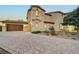 Two-story house with landscaped yard and attached two-car garage at dusk at 4807 Enchanted View St, Las Vegas, NV 89149